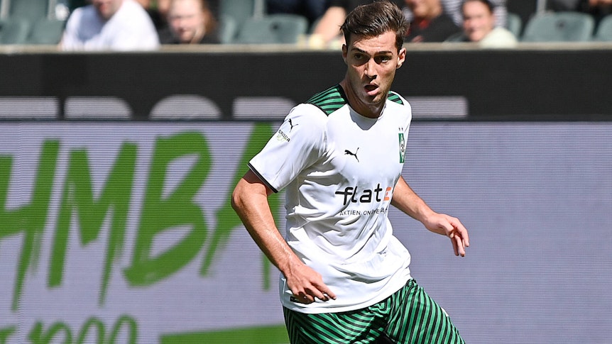 Joe Scally mit angestrengtem Blick in einer dynamischen Laufbewegung.