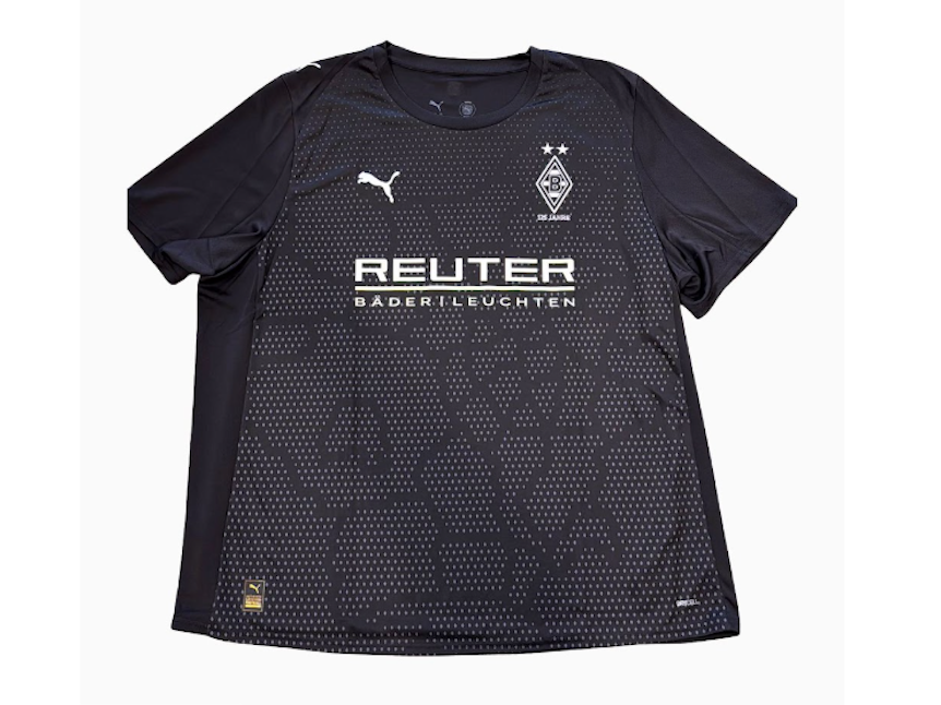 Ein schwarzes Trikot mit Mini-Rauten, die die Stadtgrenzen Mönchengladbachs darstellen.